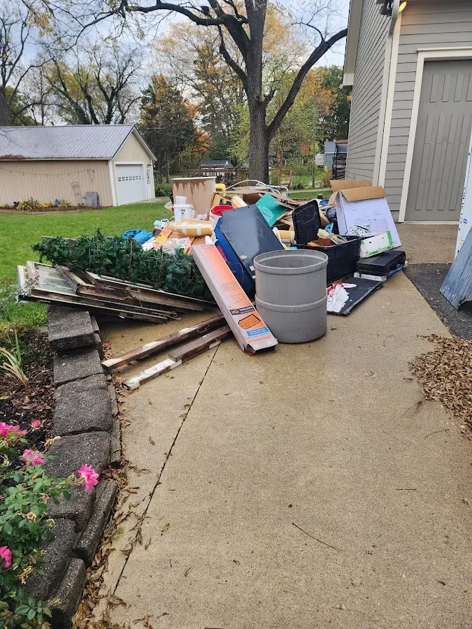 Dumpster being loaded with debris for 10 Yard Dumpster Rental in Little Rock